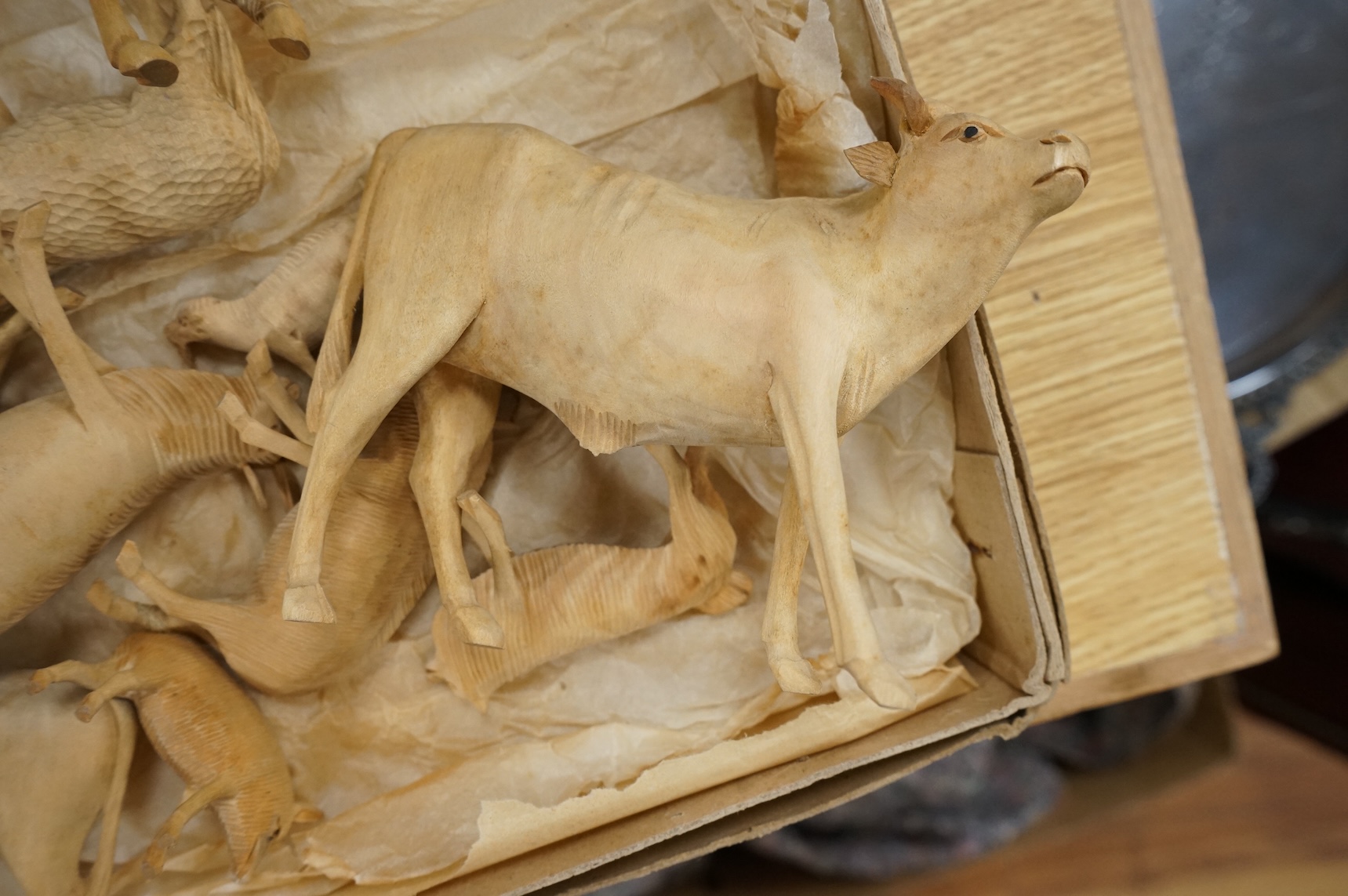 A collection of carved wood farm animals, largest 15.5cm